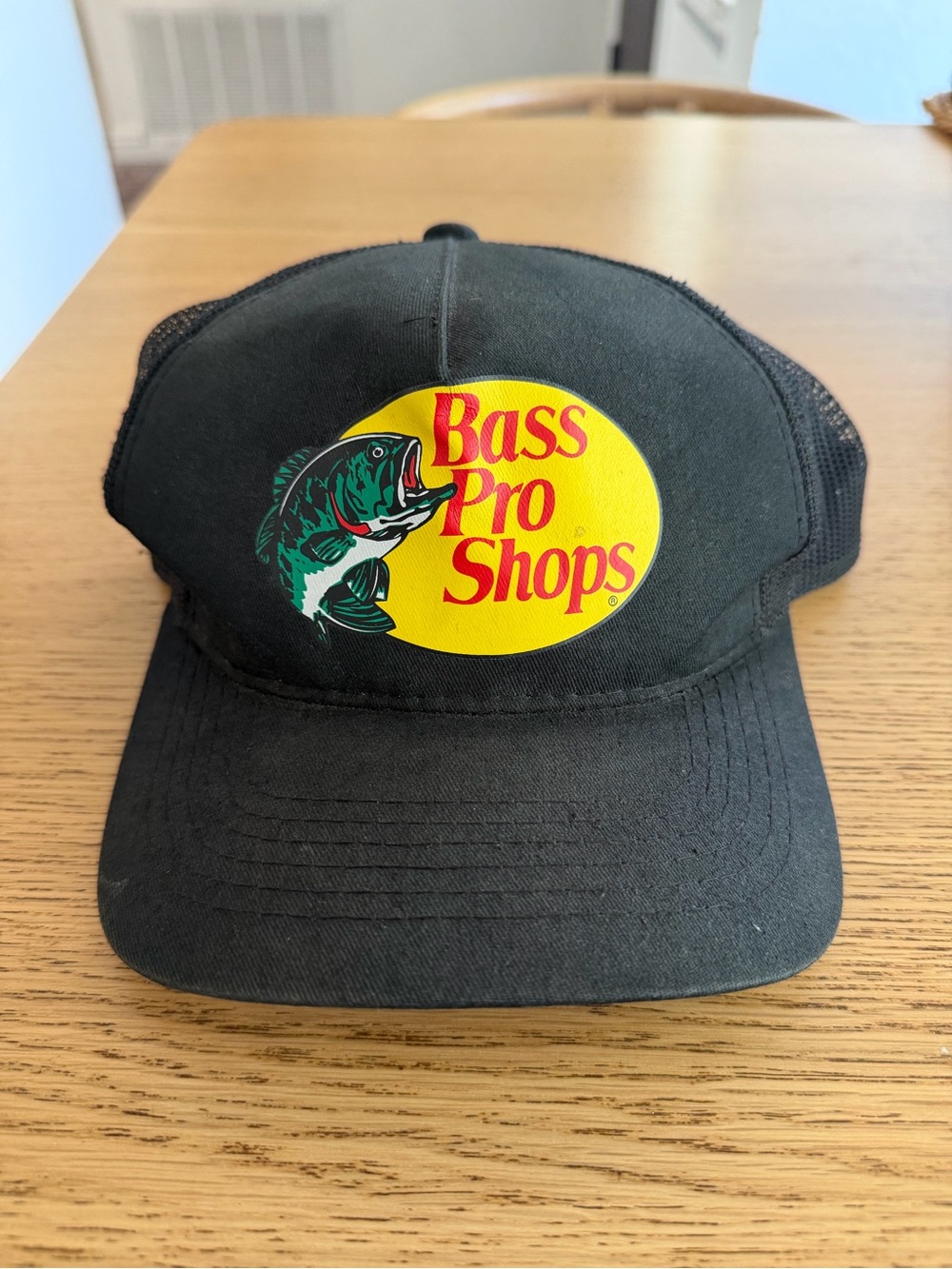 Bass Pro Shops Black Cap with Yellow Oval Logo and Green Fish